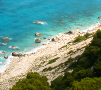 Pine forests, white cliffs and turquoise blue water on the Western coast